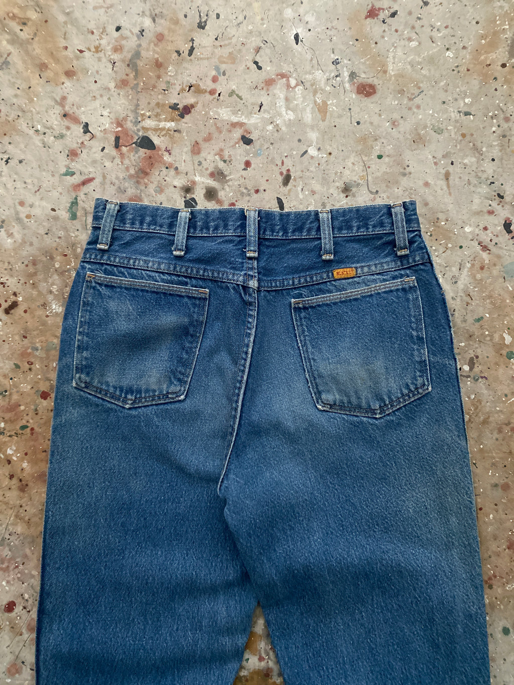 90s distressed and faded bootcut rustler jeans