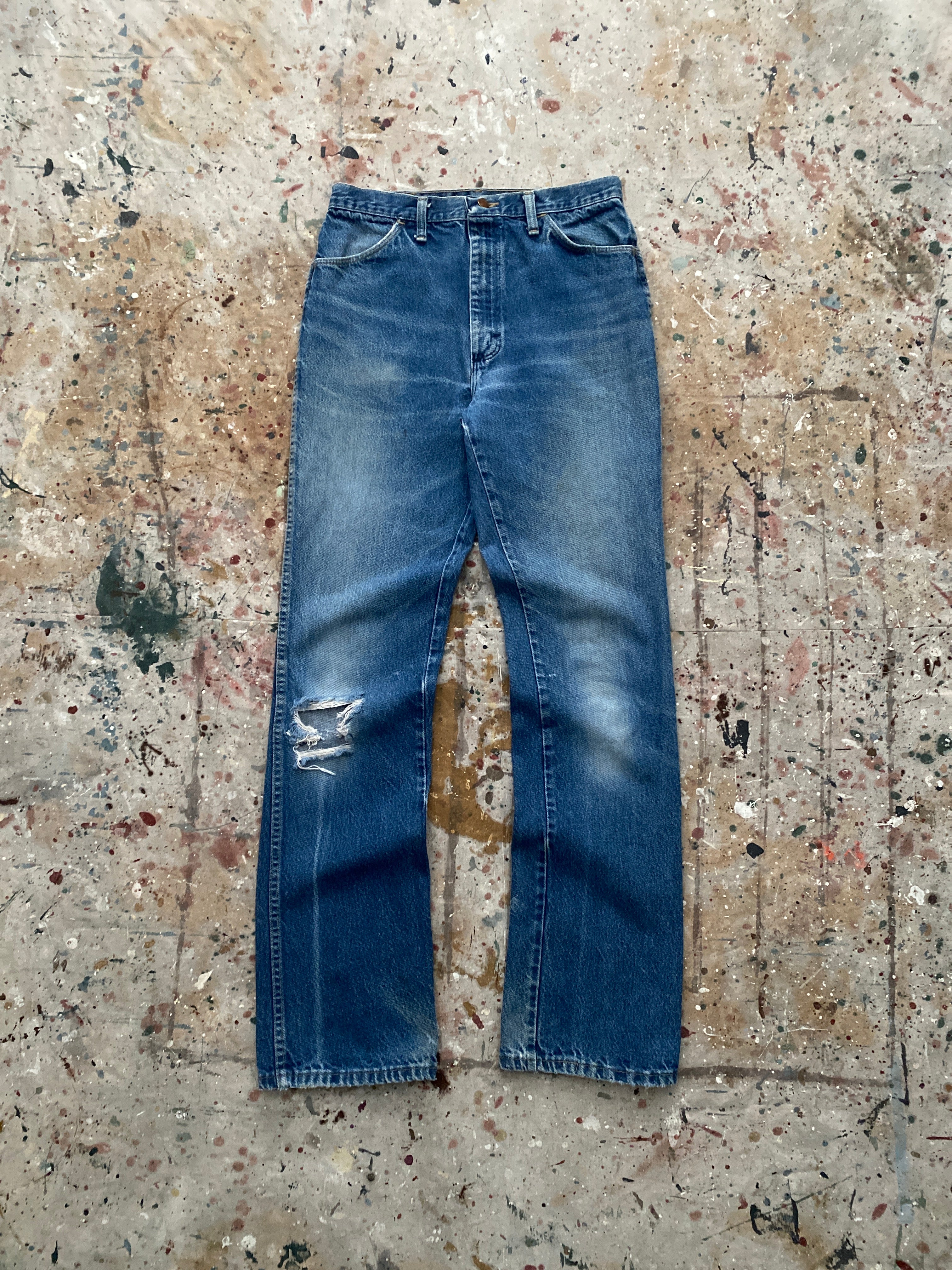 90s distressed and faded bootcut rustler jeans