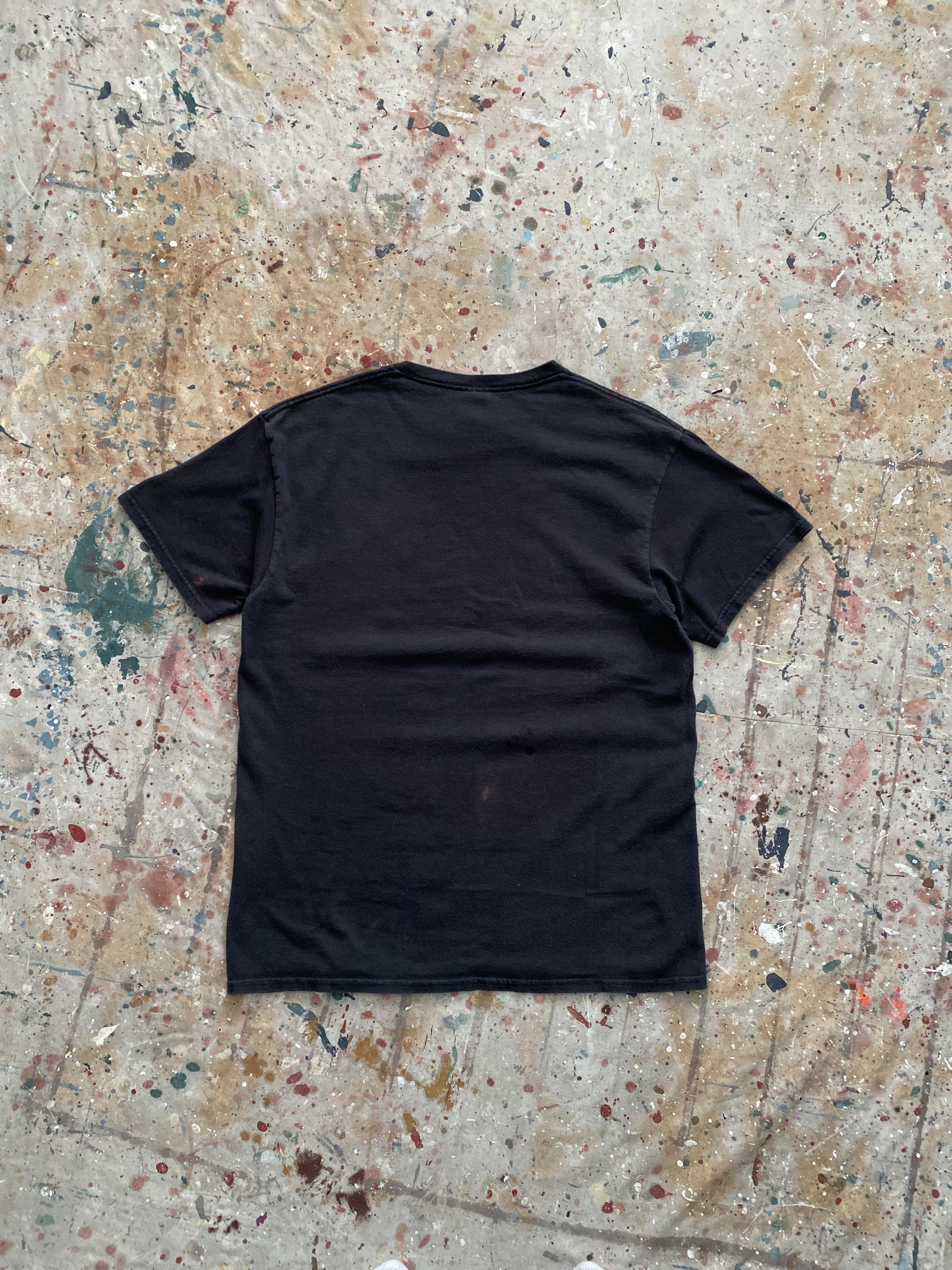 00s faded black "love stinks" skunk tee